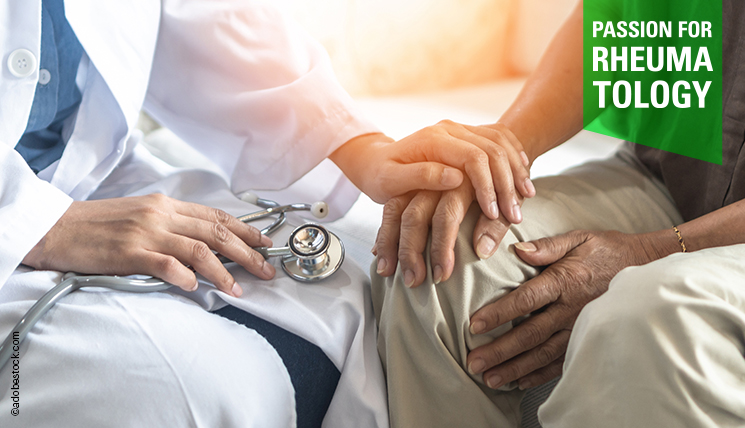 Physician touches hand of patient